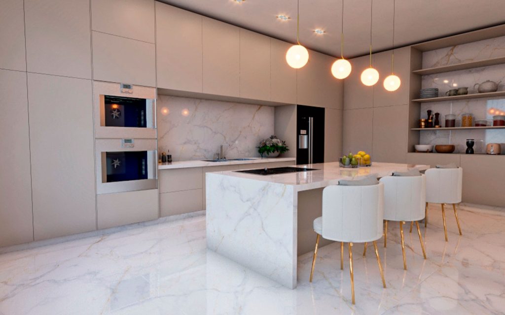 Cocina moderna con isla y mesón de gran formato sin juntas visibles